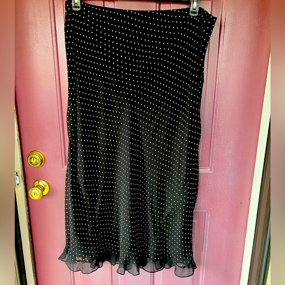INC Woman- white polka dot print on silk skirt with a ruffled bottom